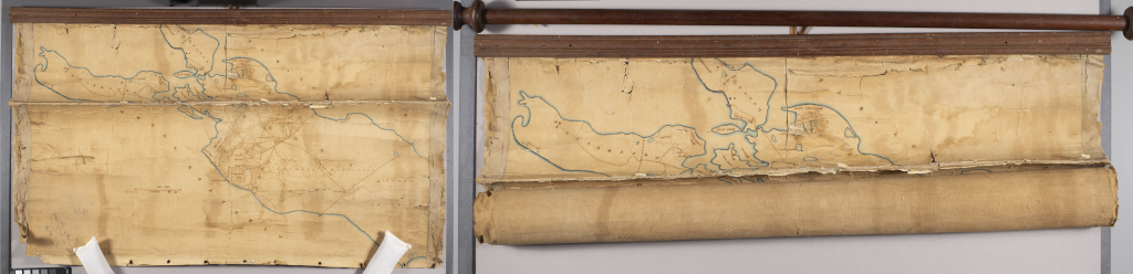 Left: Rolled map attached to a wooden rod.
Right: Unrolled map attached to a wood mount. Map has a crease down the center and is flaking at the edges.